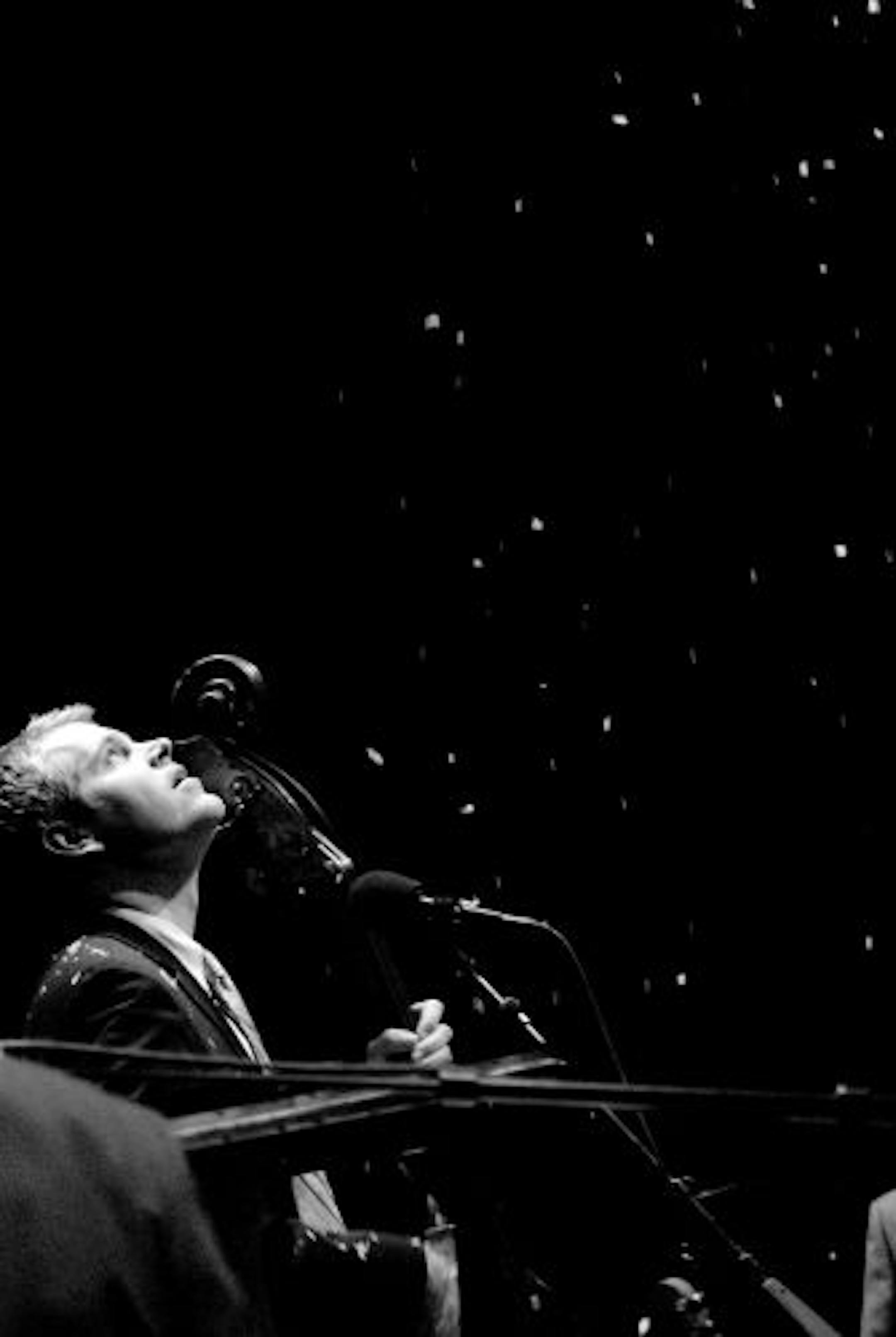Special to the Star Tribune Steven Cohen The New Standards bass player, John Munson watches the flakes fall during the song " Snow Days" during their 2008 holiday concert.