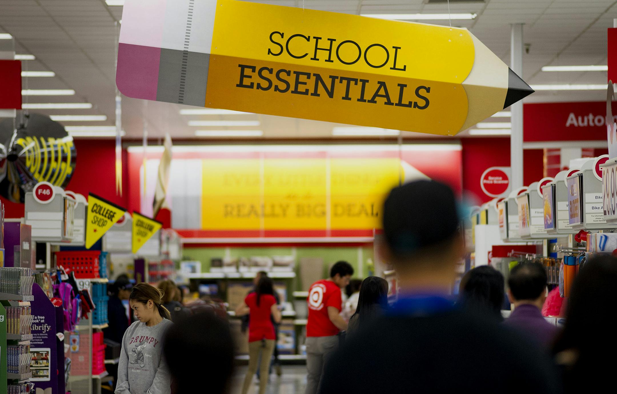 Customers shop for back to school supplies at a Target Corp. store in Colma, California, U.S., on Saturday, Aug. 9, 2014. Retailers are pushing for a longer shopping season and earlier than ever deals on order to get customers to buy more over a longer period of time, says DealNews spokesman Mark LoCastro, which tracks price and discount trends across the web, according to USA Today. Photographer: David Paul Morris/Bloomberg ORG XMIT: 506646325