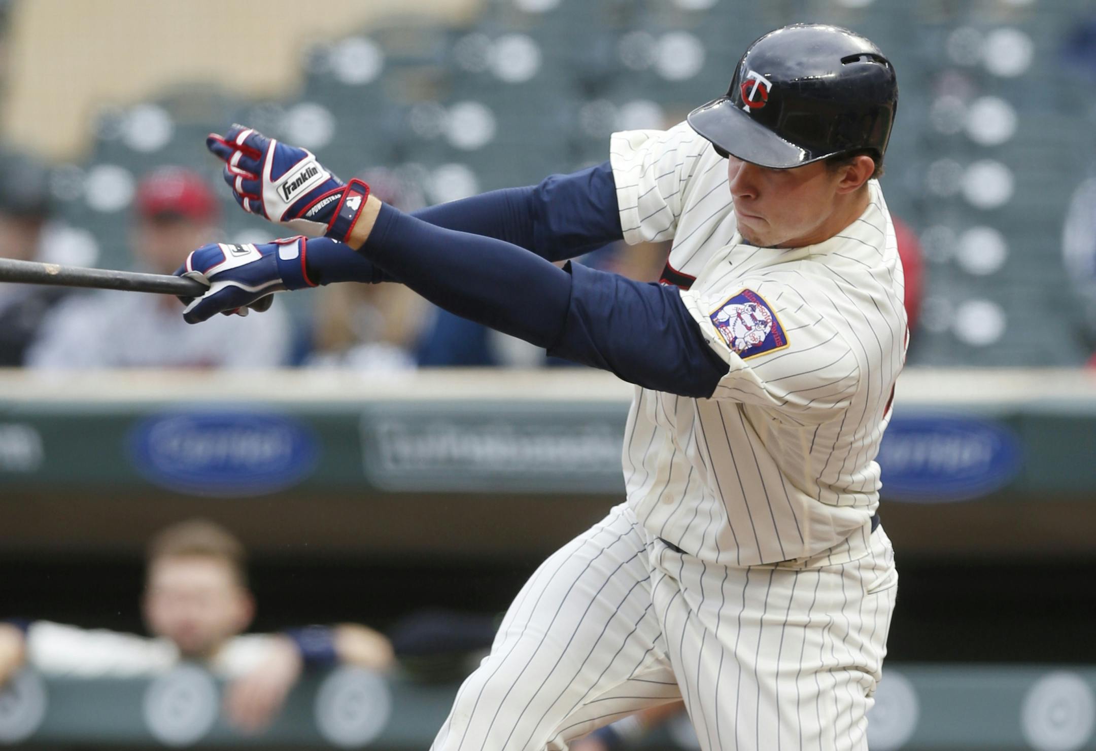 Minnesota Twins' Max Kepler follows through with an RBI single off Colorado Rockies pitcher Tyler Chatwood during the first inning of the second game of a baseball doubleheader, Thursday, May 18, 2017, in Minneapolis.