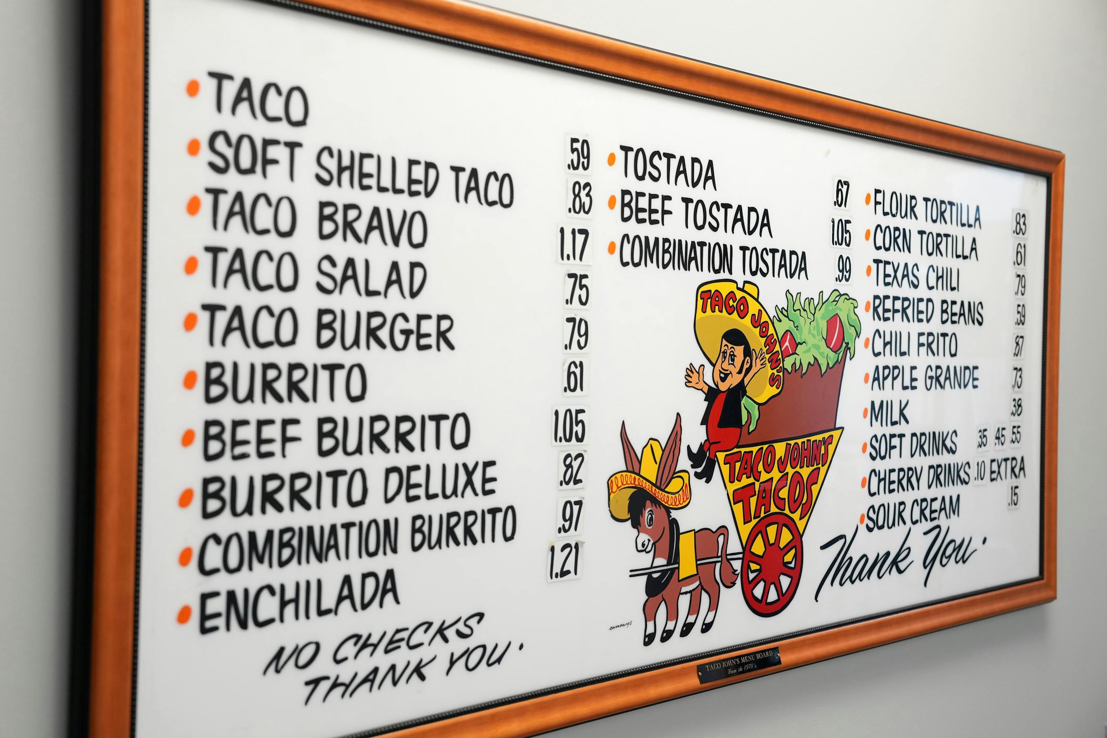 Taco John's original menu board hangs at the test kitchen.