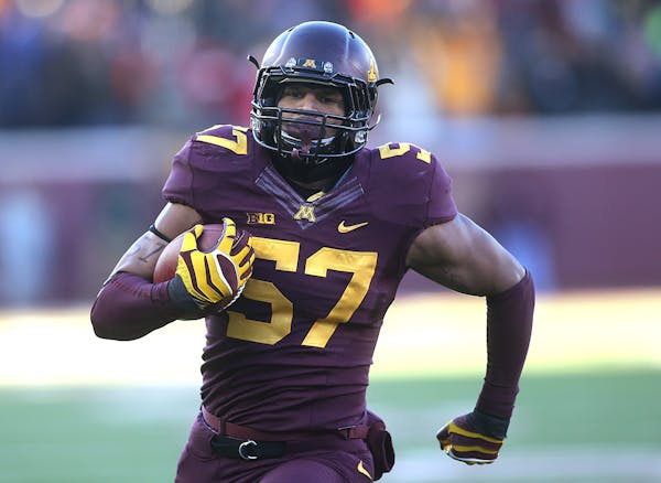 Gophers Aaron Hill ran for the end zone in the first half after an interception.