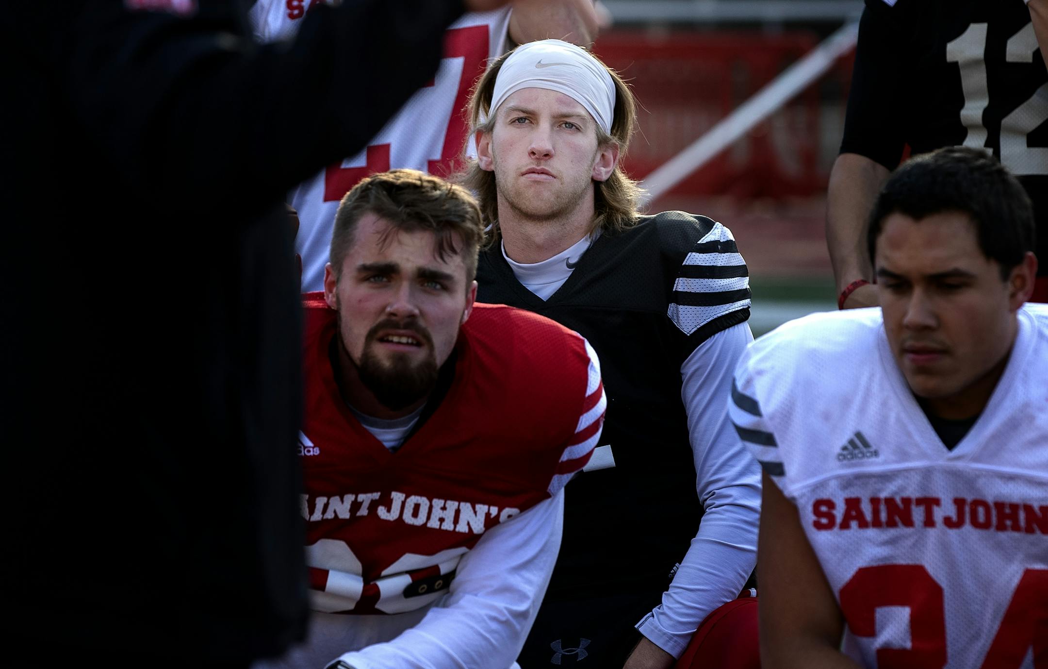 St. John's quarterback Jackson Erdmann and teammates during practice this week.