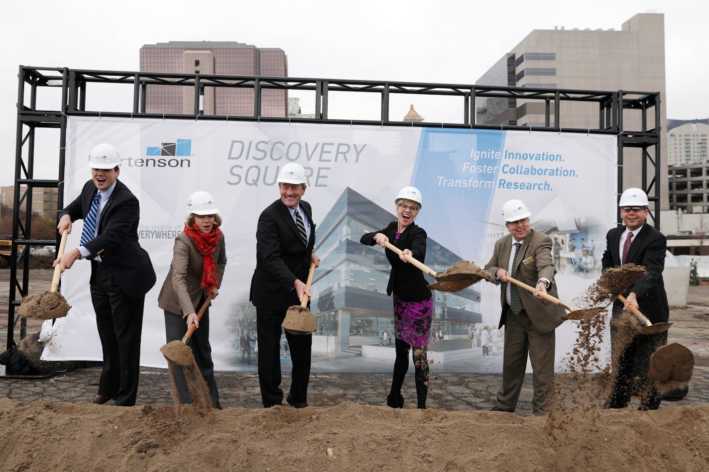 From left, Jeremy Jacobs, Lt. Gov. Tina Smith, Dr. John Noseworthy of the Mayo Clinic, Lisa Clarke, Randy Staver and David Mortenson threw dirt for an outdoor groundbreaking of Discovery Square.