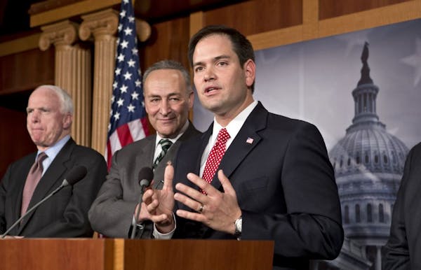 Sen. Marco Rubio, R-Fla., right, and other members of a bipartisan group of leading senators working on immigration reform.