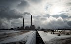 A coal train was idle on the tracks leading to the Sherburne County Generating Station in Becker, Minn. Minnesota Power and Xcel Energy have pledged t