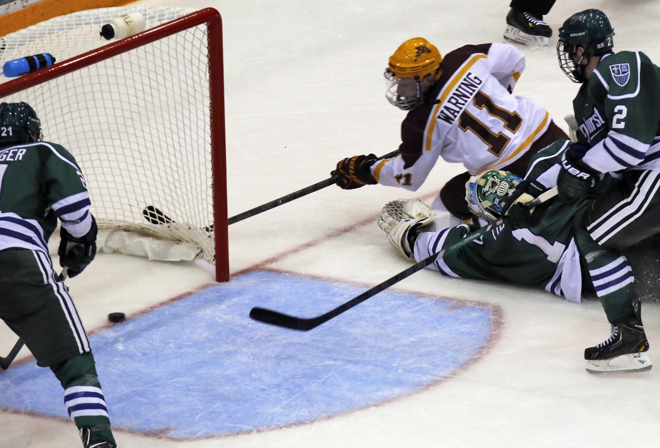 Sam Warning (11) slid the puck into the net in 2nd period action against Mercyhurst earlier this season.
