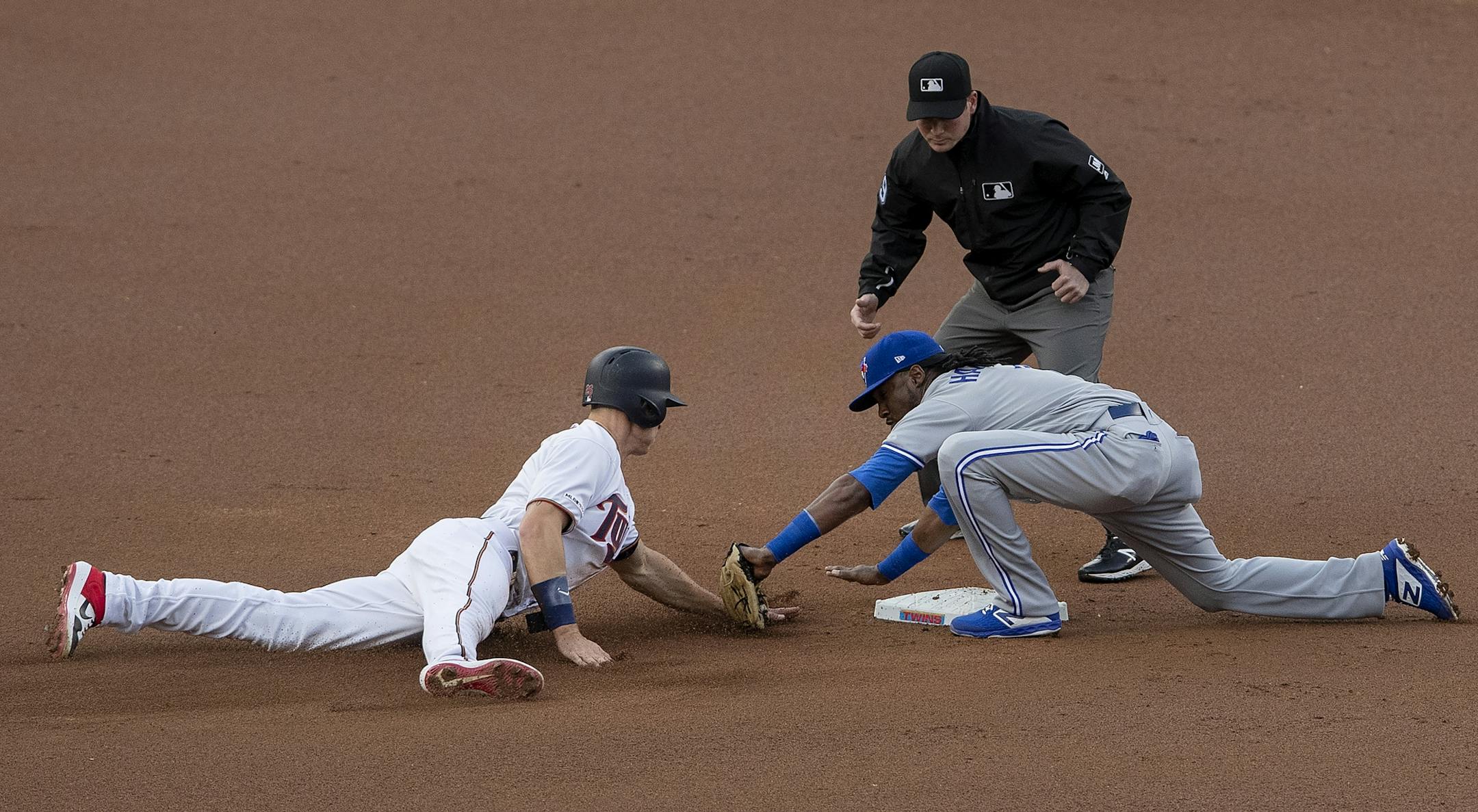 Max Kepler was tagged out at second base by Alen Hanson attempted to tag up in the first inning.