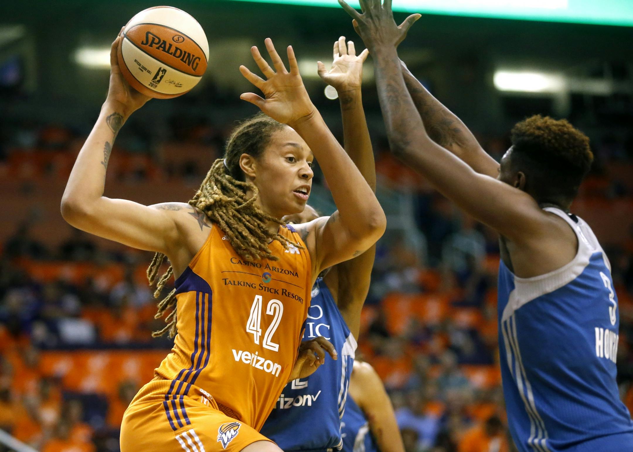 Minnesota Lynx forward Natasha Howard guards Phoenix Mercury center Brittany Griner during game 3 of the WNBA basketball semifinals in Scottsdale, Ariz., Sunday, Oct. 2, 2016.