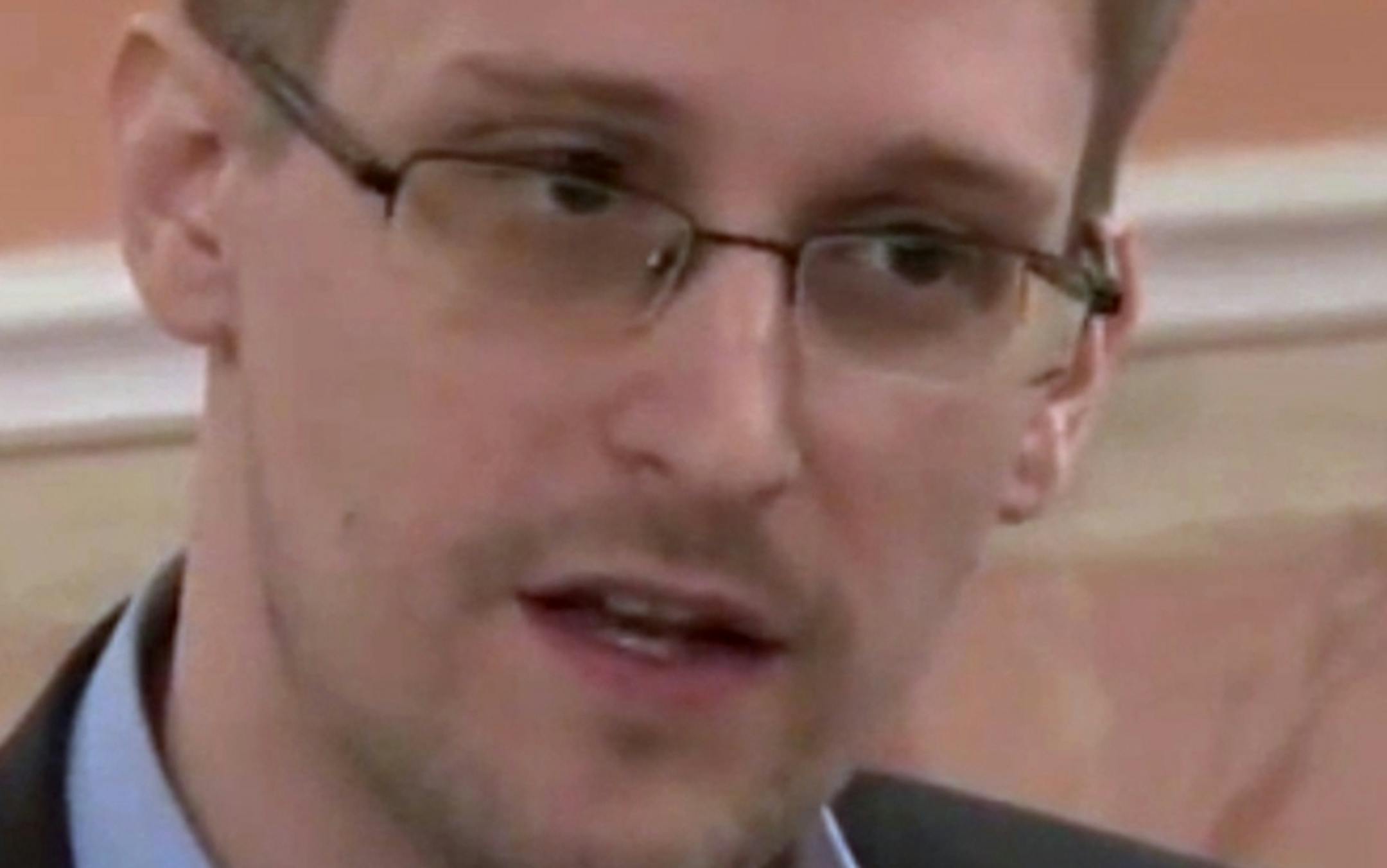 In this image made from video released by WikiLeaks on Friday, Oct. 11, 2013, former National Security Agency systems analyst Edward Snowden speaks during a presentation ceremony for the Sam Adams Award in Moscow, Russia. Should Snowden ever return to the U.S., he would face criminal charges for leaking information about NSA surveillance programs. But legal experts say a trial could expose more classified information as his lawyers try to build a case in an open court that the operations he expo