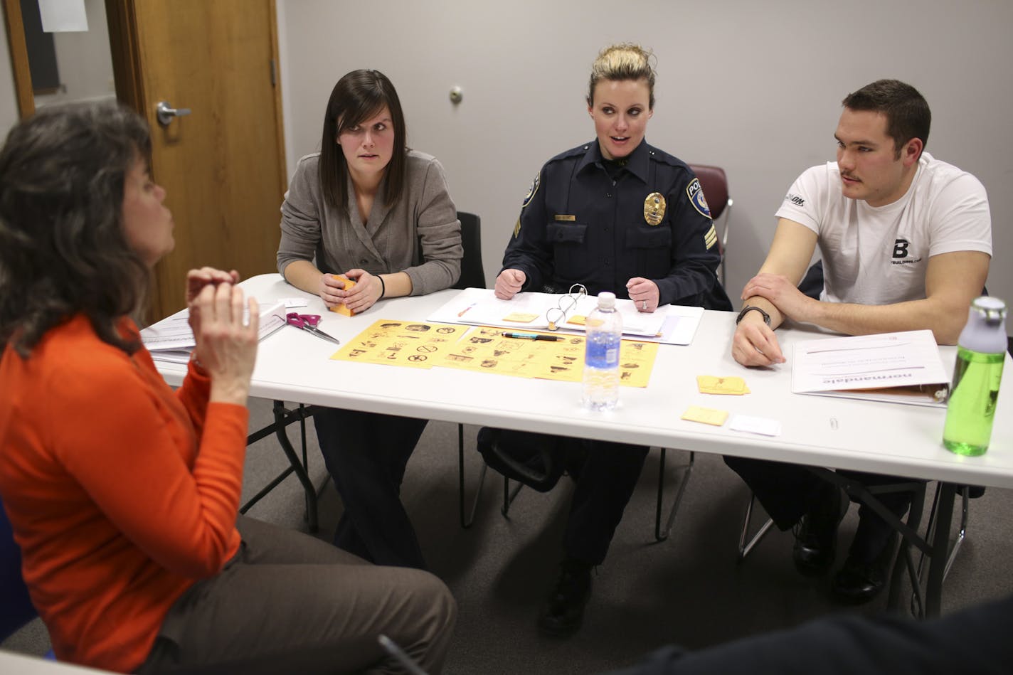 Instructor LeAnn Taylor, foreground, guided Officer Jewel Morrison, Sgt. Erin Dietz, and Community Service Officer Michael Affeldt as they put new phrases together during class Wednesday night at a Metro Transit's office in St. Paul. ] JEFF WHEELER &#x201a;&#xc4;&#xa2; jeff.wheeler@startribune.com Metro Transit police officers are encountering more and more Spanish speakers as they make their rounds and respond to calls. The problem is few officers speak the language. Now some are taking Spanish