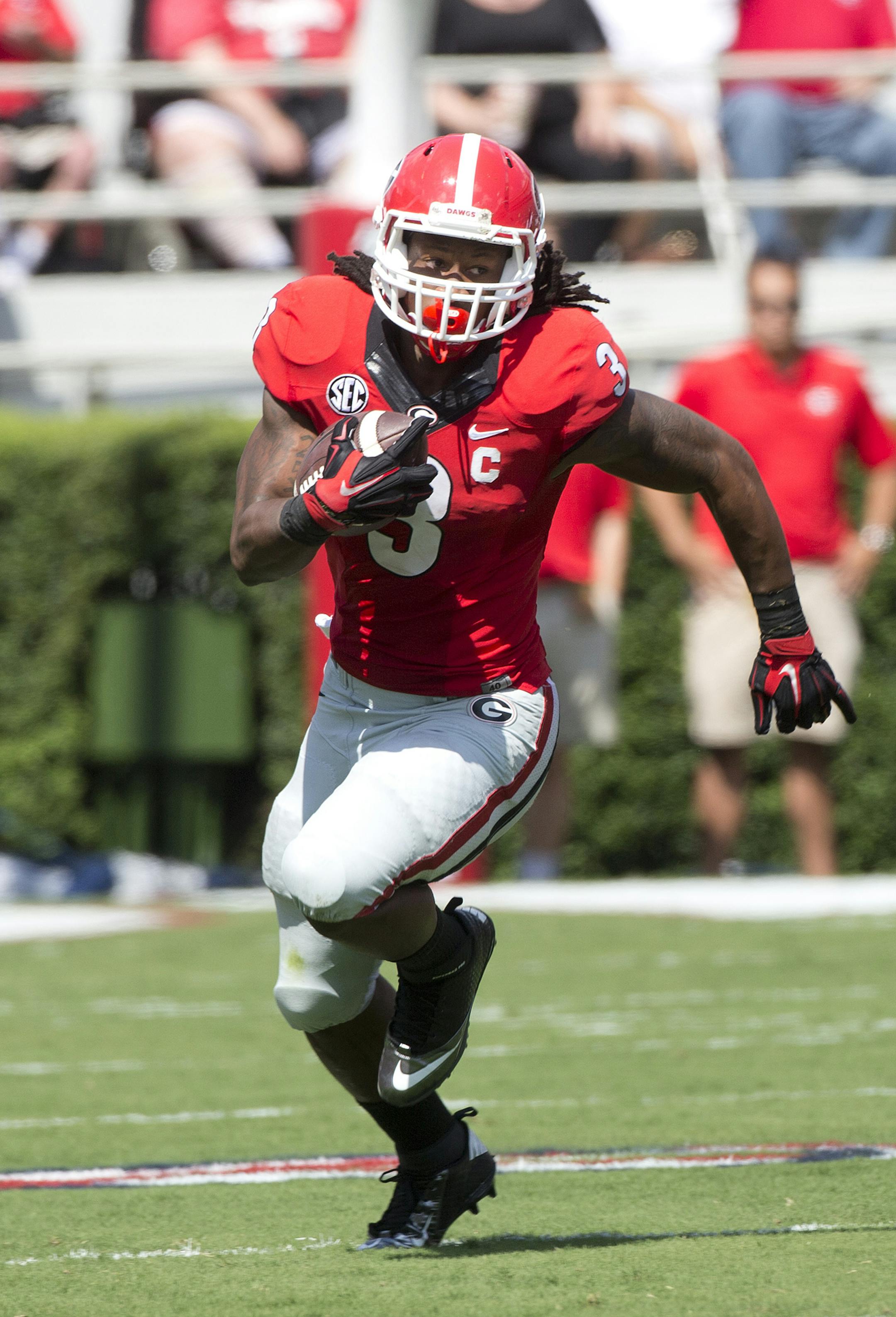 Georgia running back Todd Gurley (3) rushes for a first down in the first half of an NCAA college football game against Troy Saturday, Sept. 20, 2014, in Athens, Ga. (AP Photo/John Bazemore)