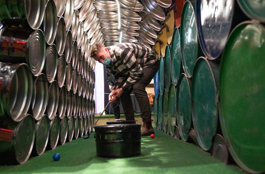 Dan Johnson reacted after missing a shot while playing mini golf early this month at Can Can Wonderland in St. Paul.