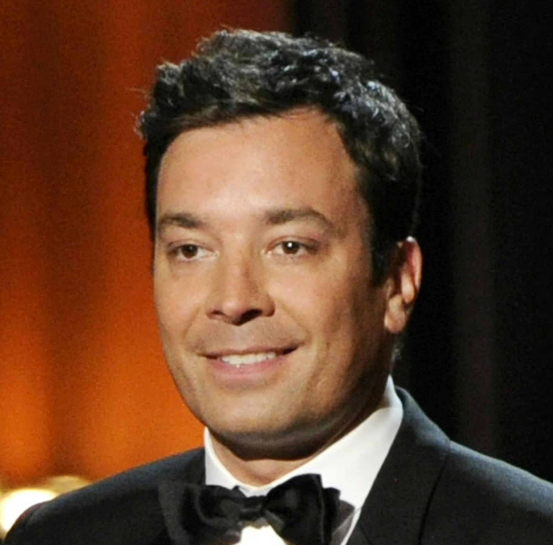FILE - In this Aug. 25, 2014 file photo, Jimmy Fallon presents an award at the 66th Annual Primetime Emmy Awards in Los Angeles. Fallon has a deal with Feiwel and Friends for the picture book ìYour Babyís First Word Will Be Dada.î Fallon says he was inspired by his daughter, Winnie Rose, whose first word, alas, was ìMama.î The publisher announced Monday, Oct. 20, that the book is scheduled for release in June. (Photo by Chris Pizzello/Invision/AP, File)
