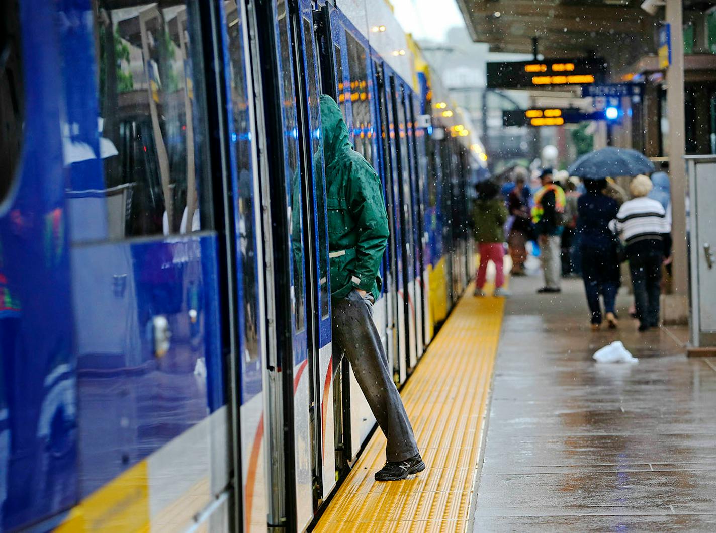 Riders prepare to board one of the first trains on the Greenline to leave the station on June 14, 2014, at Union Station in St. Paul, MN.