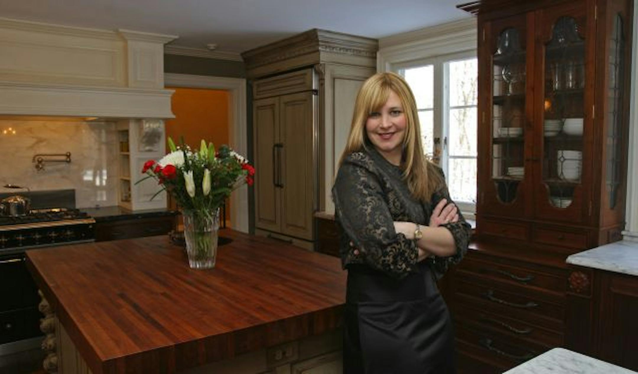 Owner Kristi Oman added a new kitchen that complements the house's original French chateau theme.