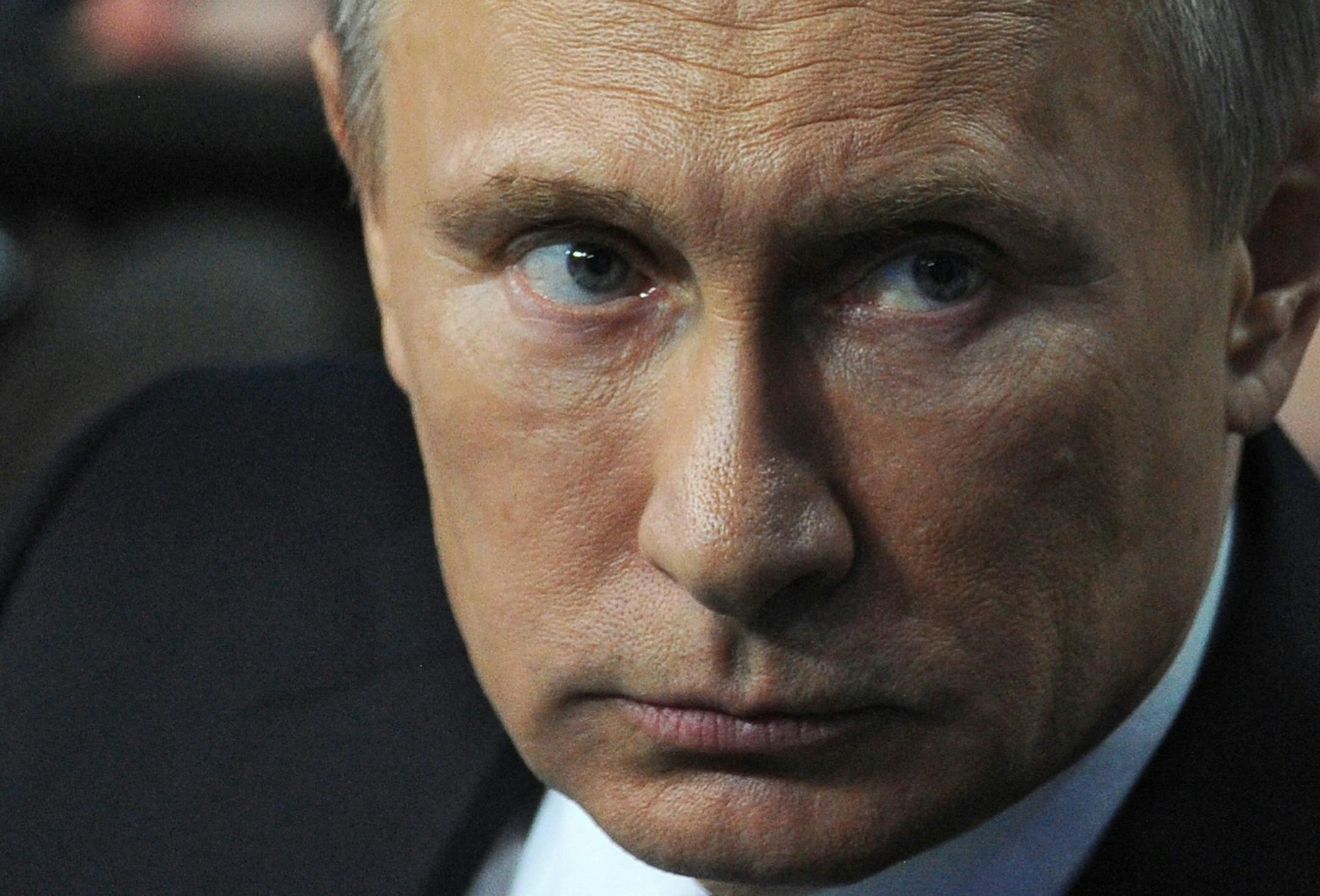 Russian President Vladimir Putin attends a media meeting organized by the Russian People's Front in St. Petersburg, Russia, Thursday, April 24, 2014. Russia’s President Vladimir Putin has mocked the Internet as a CIA project and pledged to protect Russia’s interest in the online industry. (AP Photo/RIA-Novosti, Mikhail Klimentyev, Presidential Press Service)