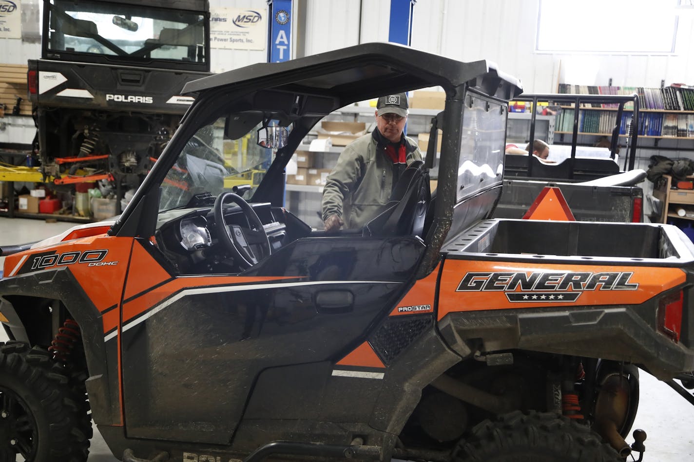 Randy Knadle, service manger at Cannon Power Sports, Inc., inspected last week in Cannon Falls, Minn., a Polaris ATV General 1000 that has been recently recalled due to potential fire risks.