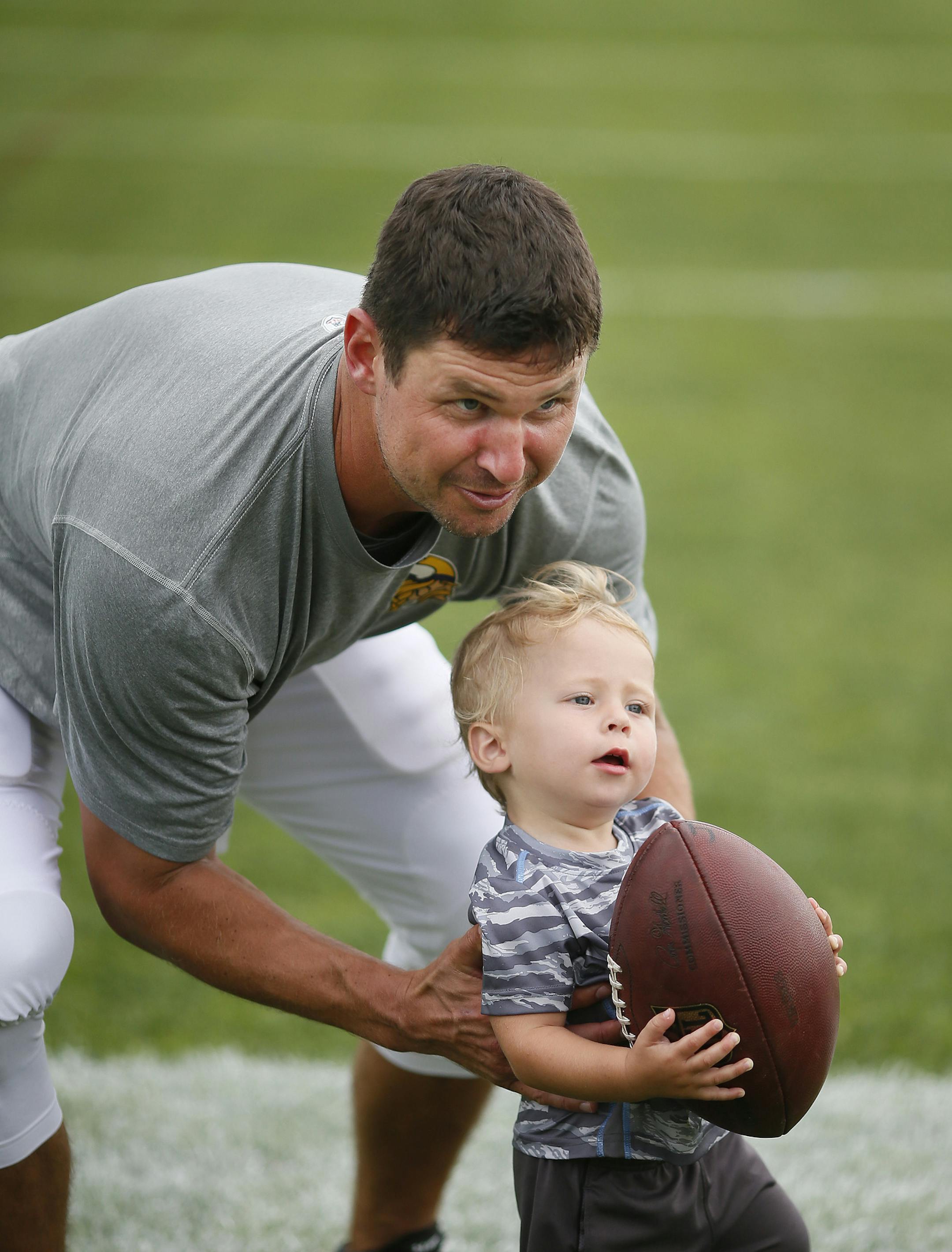 Shaun Hill played with his 18-month-old son Theo after practice at Vikings training camp at Minnesota State University Mankato Tuesday July 28, 2015 in Mankato, MN. ] Jerry Holt/ Jerry.Holt@Startribune.com