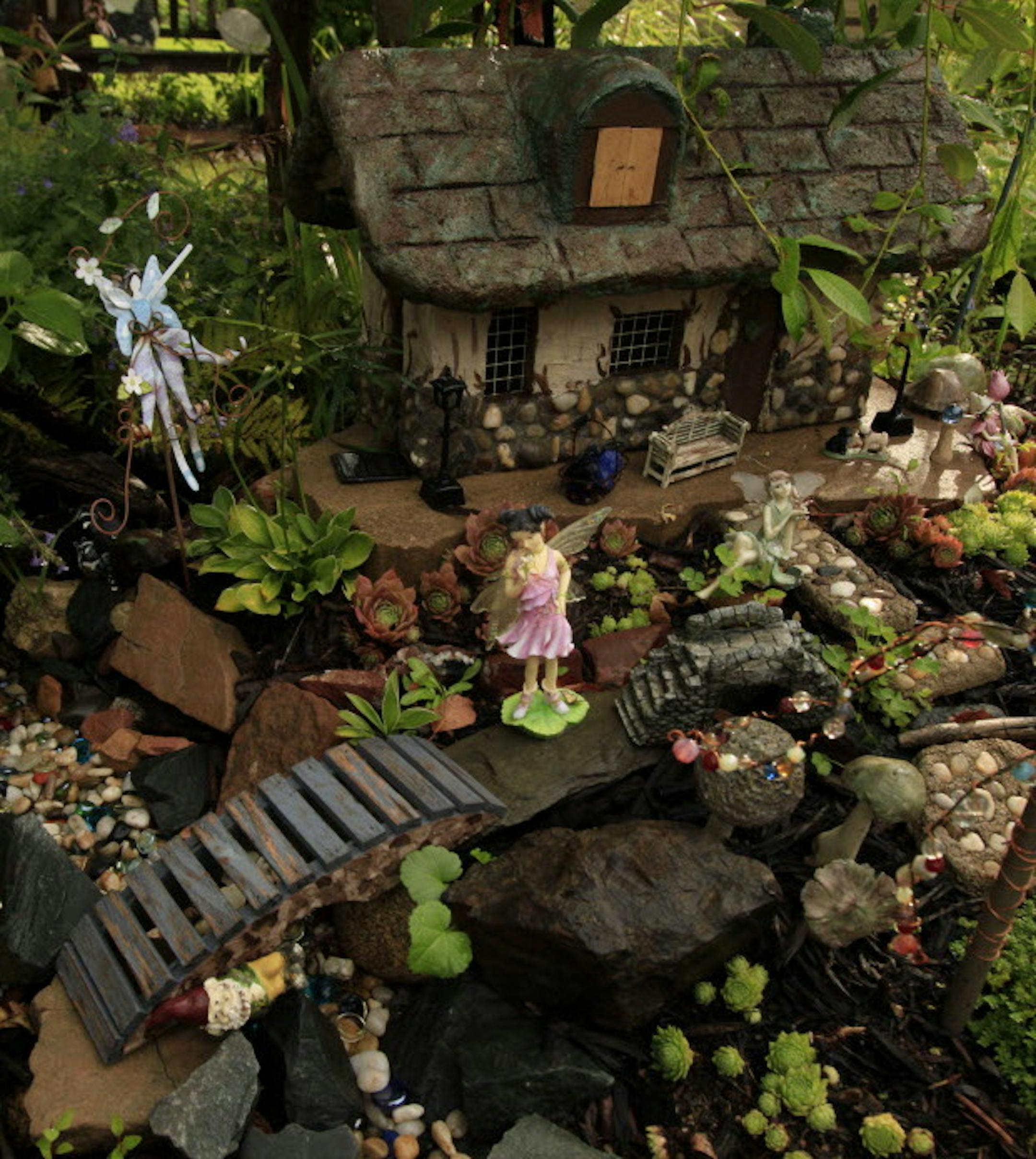 Bob and Enid Erickson's fairy garden in Bloomington, MN. August 15, 2012. ] JOELKOYAMA&#x201a;&#xc4;&#xa2;joel.koyama@startribune.com This is a Home & Garden story about the trend toward "fairy gardens," tiny fanciful fairy environments that gardeners create in their landscape.