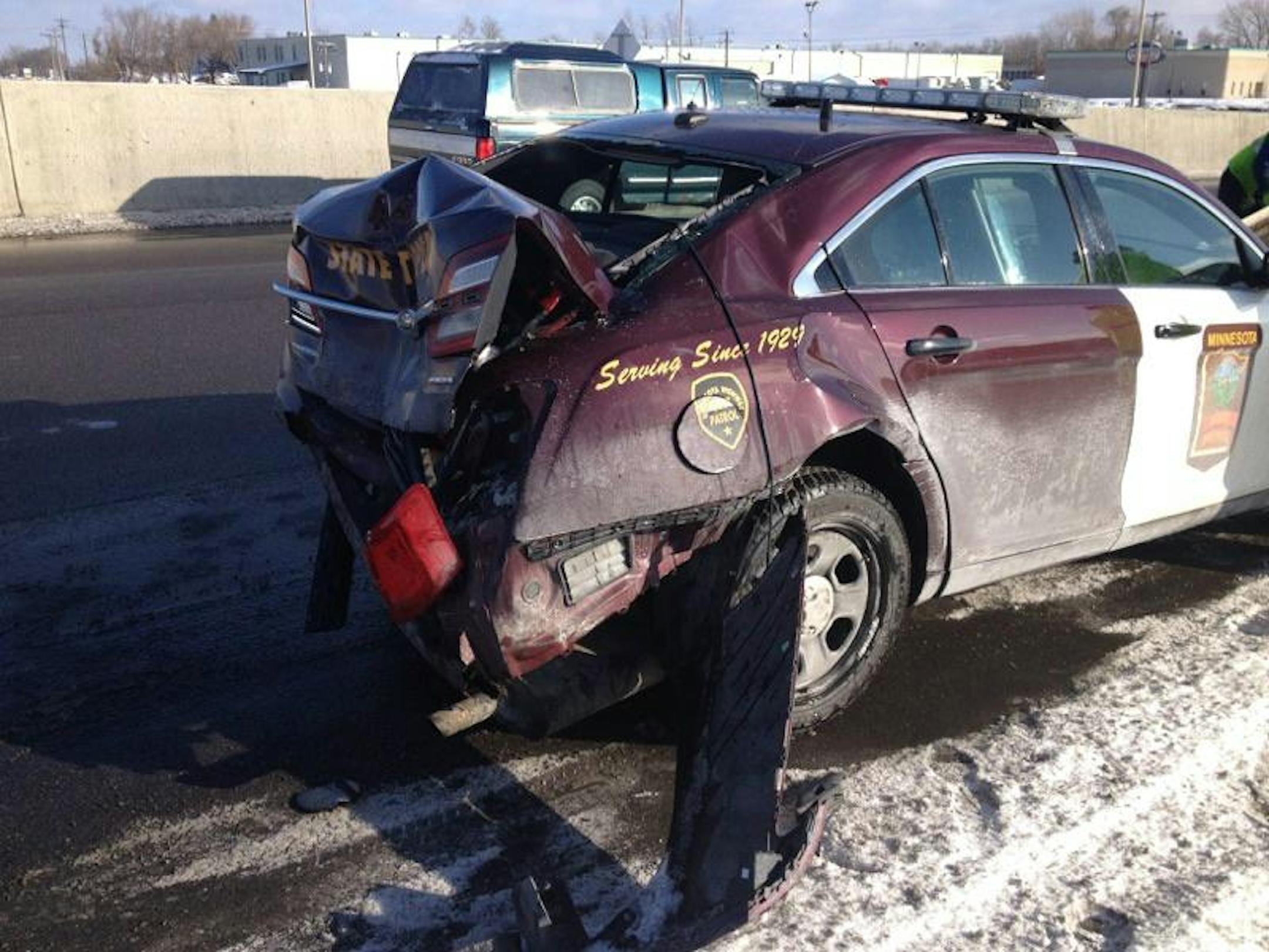 This State Patrol squad car got crunched in Maplewood while on the highway shoulder. The trooper was hospitalized.