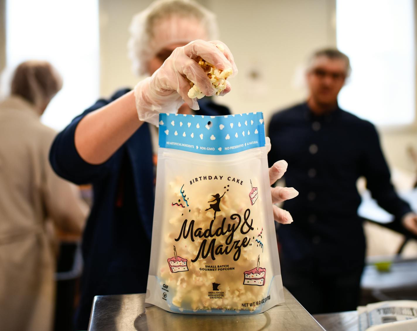 Judy Gaunt, a part-time employee at Maddy and Maize, pulled a few pieces of popcorn out of a bag as she weighed each individual package Thursday. ] AARON LAVINSKY &#xef; aaron.lavinsky@startribune.com Maddy and Maize, a Twin Cities-based gourmet popcorn company that started just a year ago has been featured at Target for the past 6 months. . The popcorn was featured in snack boxes at the Golden Globes and the Oscars. Unusual flavors is a key to its success. We photograph operations at Maddy and