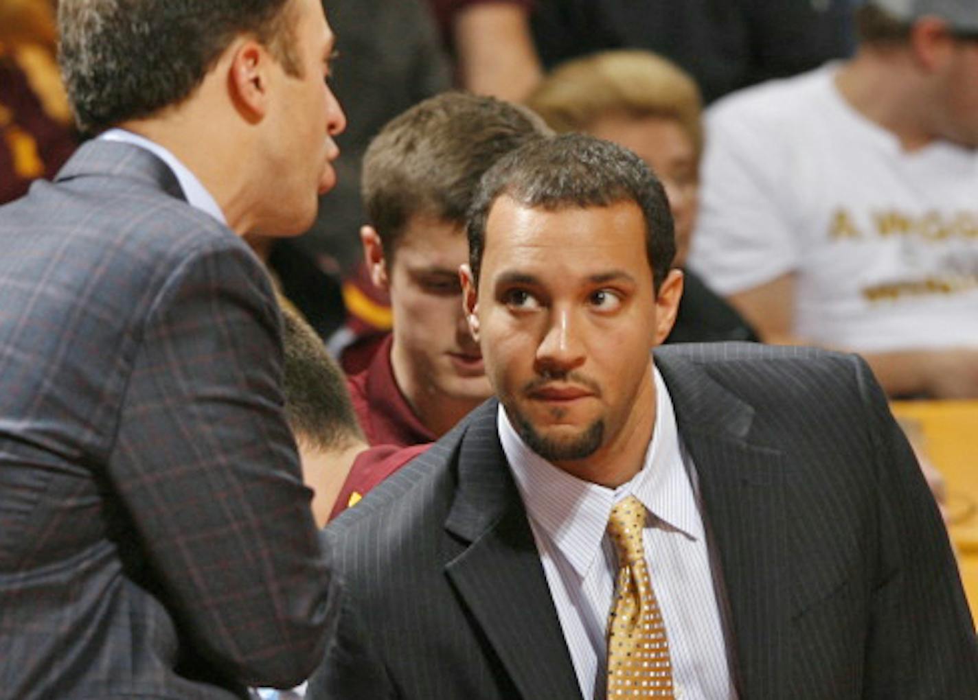 University of Minnesota photo
Assistant Ben Johnson, right, listened to head coach Richard Pitino during a 2017 home game.