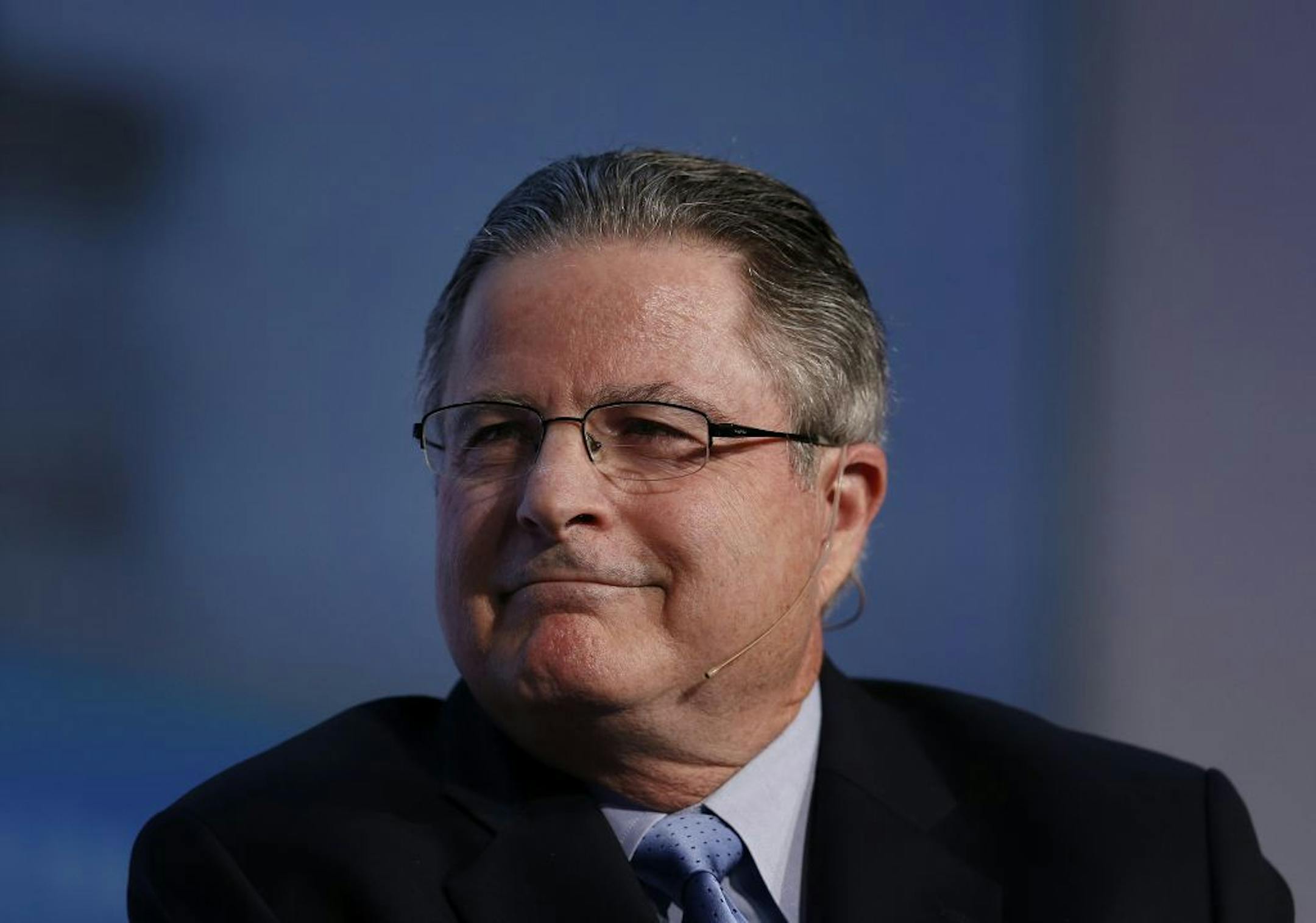 John Watson, chairman and chief executive officer of Chevron Corp., smiles during the 2014 IHS CERAWeek conference in Houston, Texas, U.S., on Tuesday, March 4, 2014. IHS CERAWeek is a gathering of senior energy decision-makers from around the world to focus on the accelerating pace of change in energy markets, technologies, geopolitics, and the emerging playing field. Photographer: Aaron M. Sprecher/Bloomberg John Watson