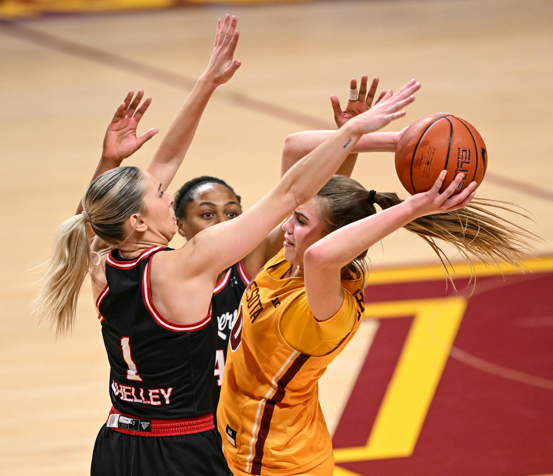Nebraska guard Jaz Shelley (1) and guard Sam Haiby (4) guard Minnesota guard Mara Braun (10) late during the second half.
