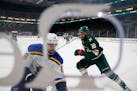 Minnesota Wild left wing Jordan Greenway (18) and St. Louis Blues defenseman Marco Scandella (6) battled during the first period.