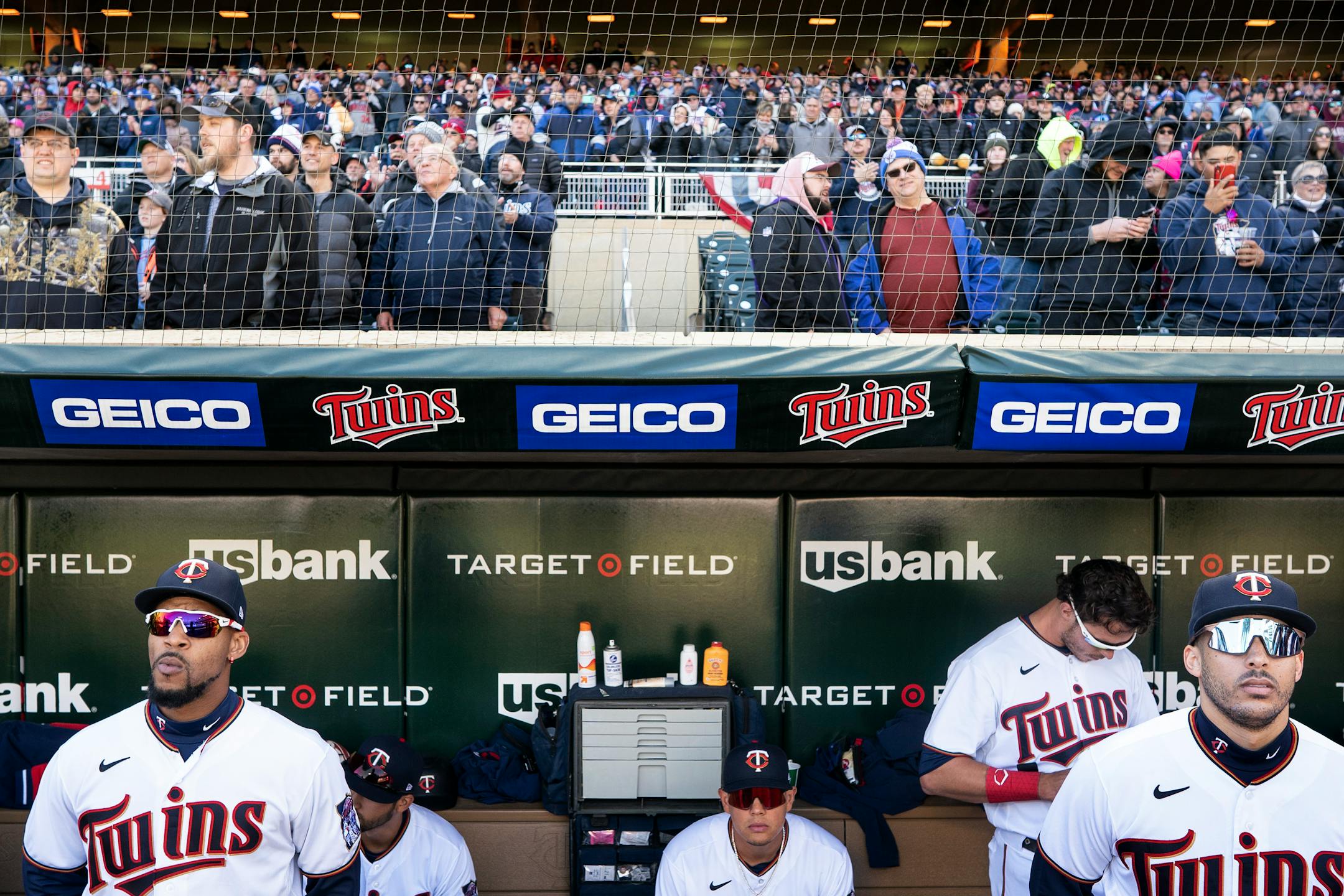 Minnesota Twins center fielder Byron Buxton , (25) left and shortstop Carlos Correa ,(4) stood in the dugout at Target Field during pregame in Minneapolis, Minn., on Friday, April 8, 2022.