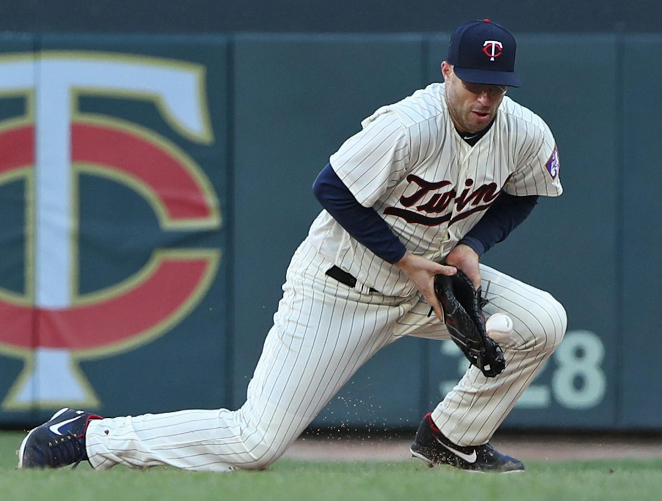 Twins first baseman Joe Mauer bobbled then recovered the ball to get an out on Seattle's Kyle Seager in the ninth inning. ] Shari L. Gross &#xef; shari.gross@startribune.com The Mariners defeated the Twins 11-4 on Saturday, April 7, 2018 at Target Field in Minneapolis.