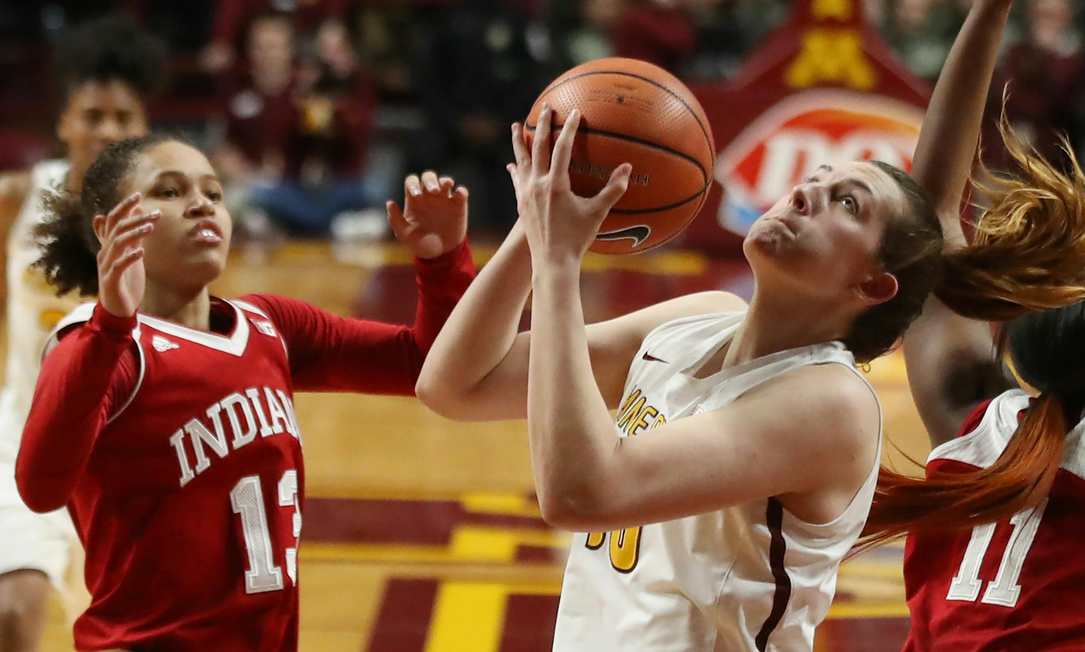Minnesota Golden Gophers center Jessie Edwards (10) rebounded over Indiana Hoosiers forward Kym Royster (11) and Jaelynn Penn (13) in the first half at Williams Arena Tuesday Feb 20, 2018 in Minneapolis, MN.] Minnesota hosted Indiana at Williams Arena . JERRY HOLT &#xef; jerry.holt@startribune.com