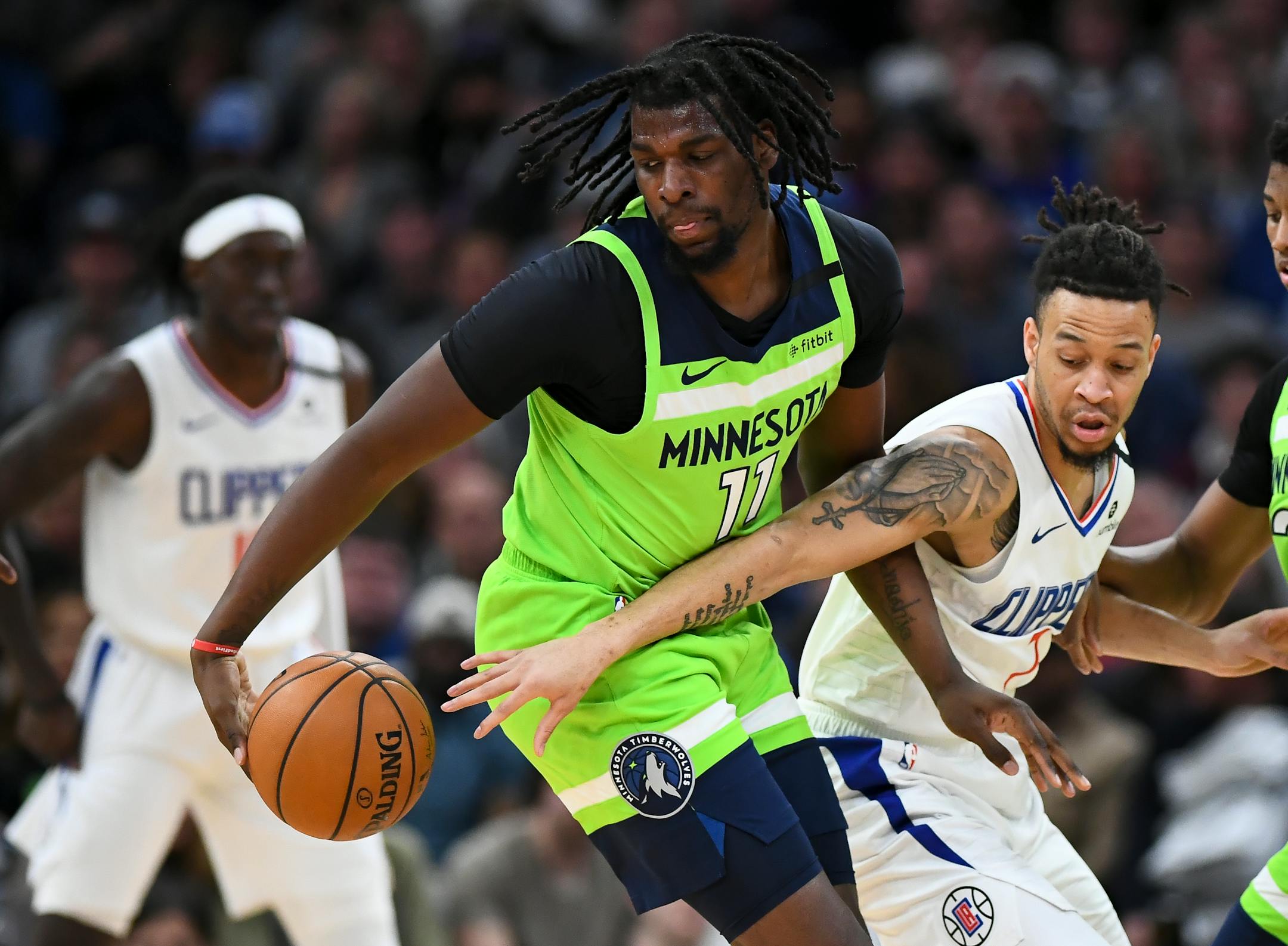 Amir Coffey guarded Timberwolves center Naz Reid earlier this month at Target Center.