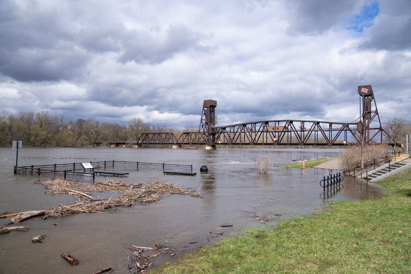 The Mississippi River floods Levee Park along the Hastings Riverwalk Friday in Hastings, Minn.