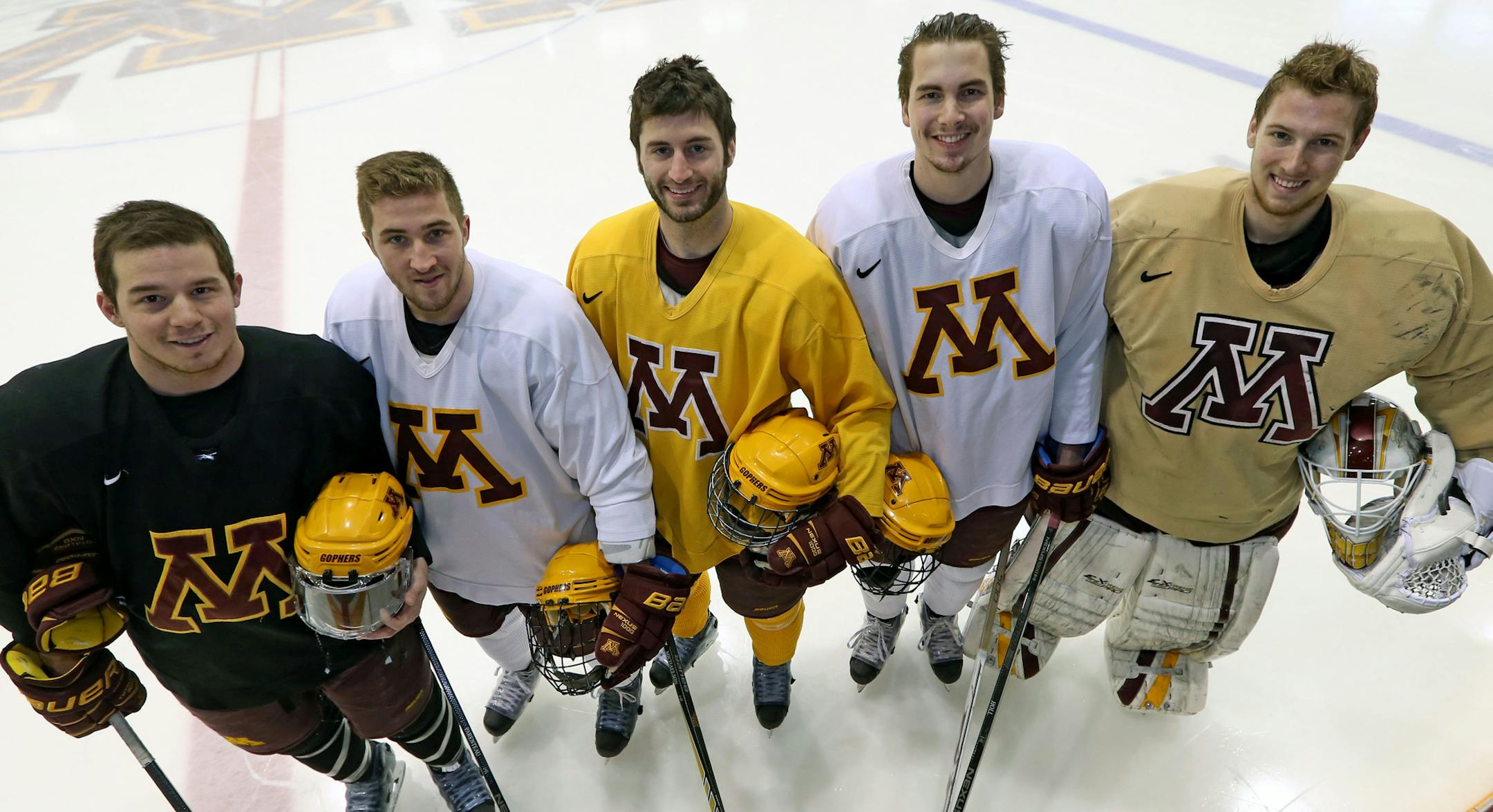 Gopher Senior hockey players, (left to right) Tom Serratore, Jake Parenteau, Nate Condon, Justin Holl and Michael Shibrowski. Photographed 3/26/14 at Ridder Arena.] Bruce Bisping/Star Tribune bbisping@startribune.com Tom Serratore, Jake Parenteau, Nate Condon, Justin Holl and Michael Shibrowski/roster.