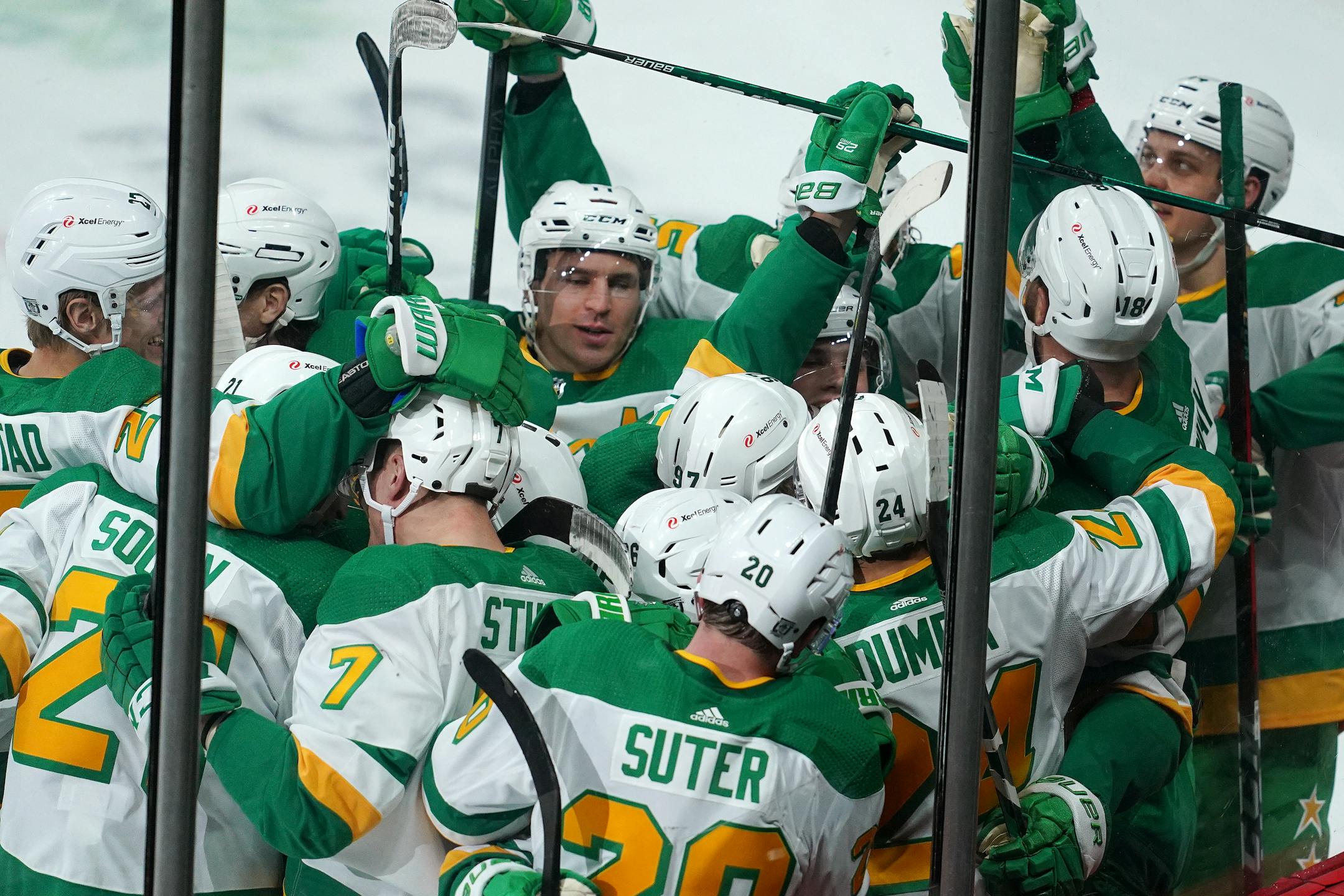 Minnesota Wild defenseman Matt Dumba was mobbed by his teammates on the ice after scoring the game winning goal past Los Angeles Kings goaltender Calvin Petersen (40) in overtime Saturday. ] ANTHONY SOUFFLE • anthony.souffle@startribune.com