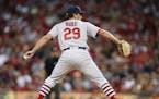 St. Louis Cardinals relief pitcher Zach Duke (29) throws against the Cincinnati Reds during the seventh inning of a baseball game, Friday, Aug. 4, 201
