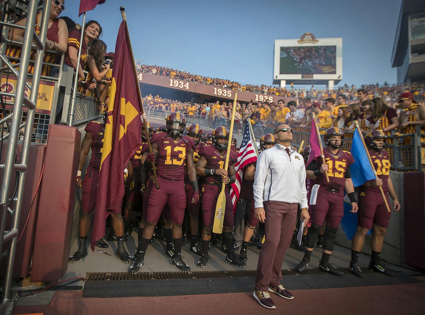 Minnesota Gophers coach P.J. Fleck led his team onto the field Thursday night in the season opener, his first at the helm of Minnesota.