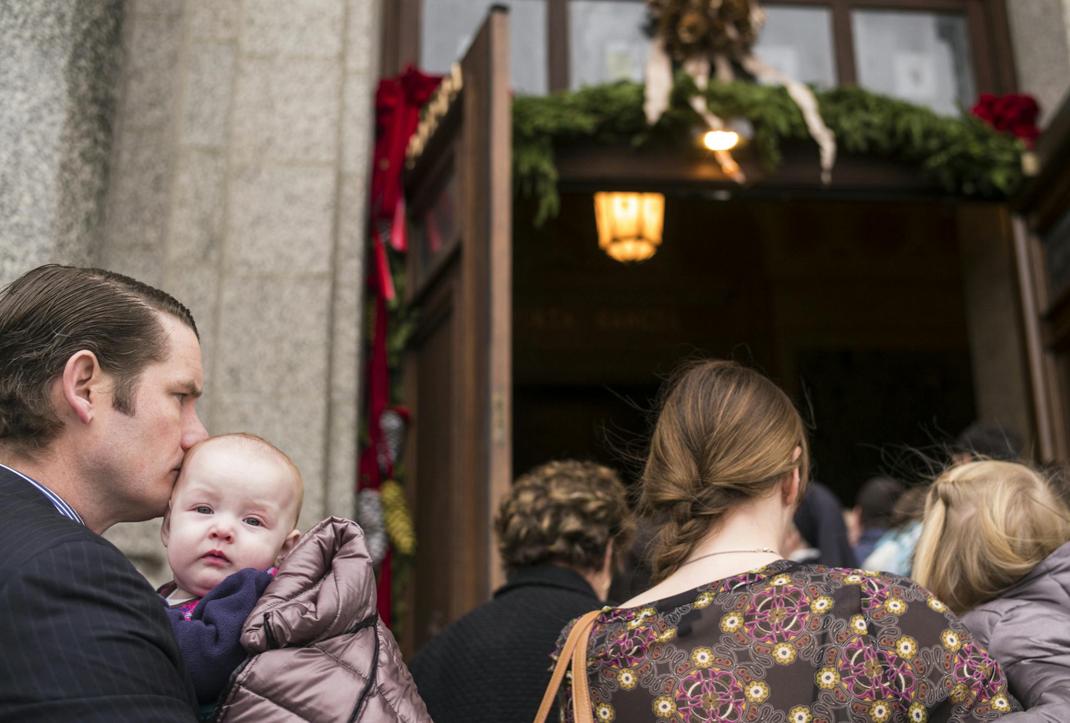 At the St. Paul Cathedral, Devin Foley, daughter Mary Margaret, six months, along with the rest his family were about to walk through the "Porta Sacra." Archbishop Bernard Hebda opened the sealed Holy Doors, which marked the beginning of the Jubilee Year of Mercy locally.] Richard Tsong-Taatarii/rtsong-taatarii@startribune.com
