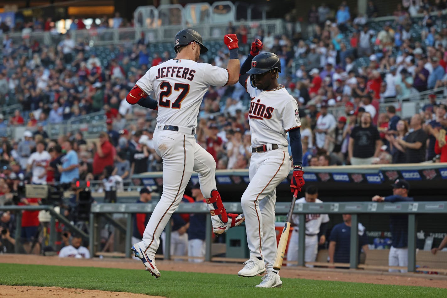 Ryan Jeffers is greeted by Nick Gordon after Jeffers hit a home run during the fifth inning Wednesday