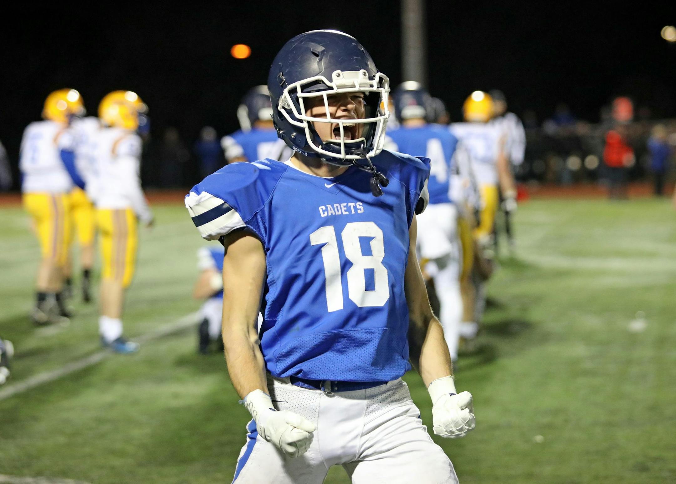 Hayes Reding (18) celebrates a Cadet fumble recovery late in the first half. St. Thomax Academy rolled past Hastings to capture the Class 5A, Section 3 title by a score of 41-6. Photo by Cheryl Myers, SportsEngine