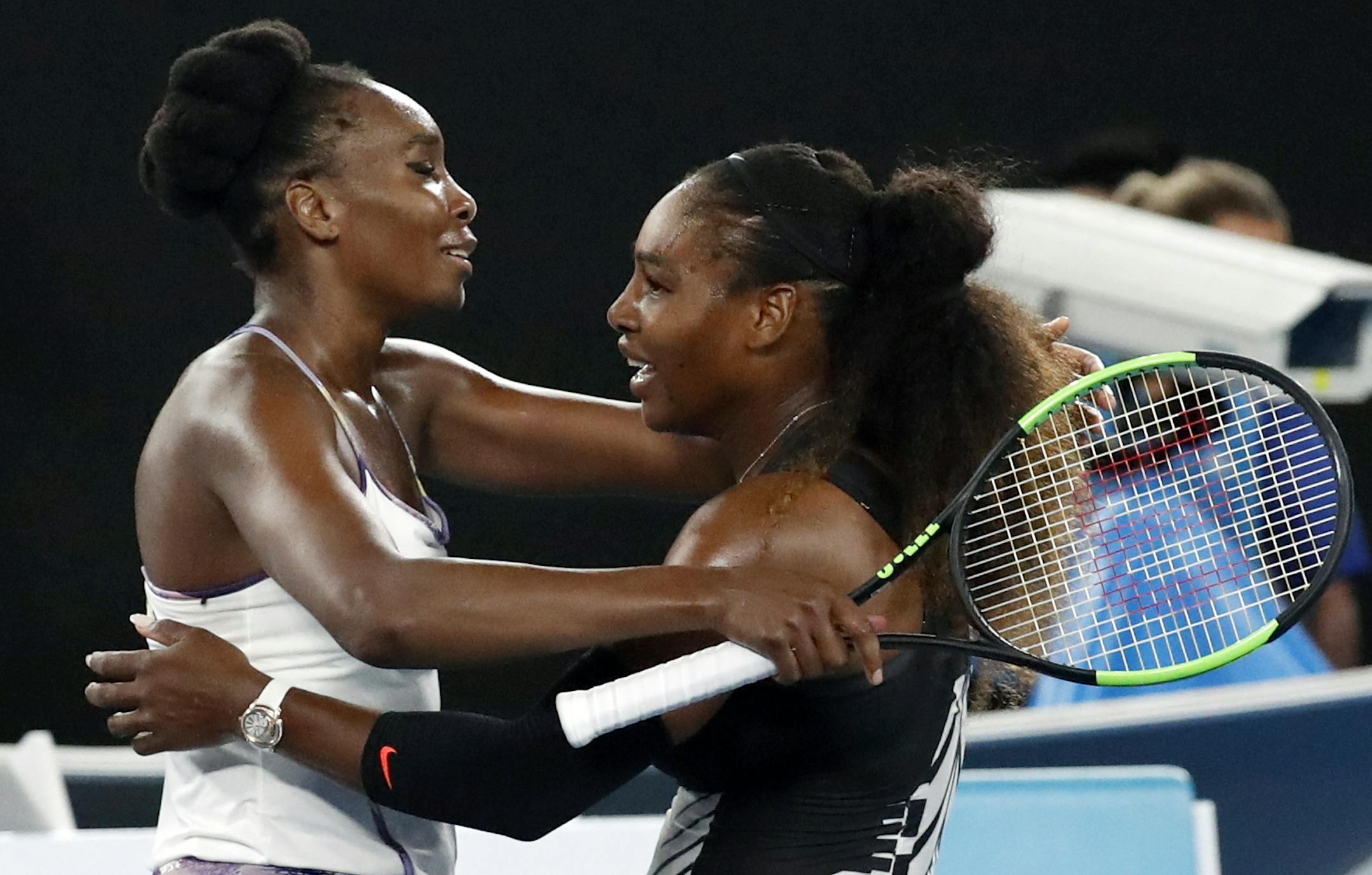 United States' Serena Williams, right, and her sister Venus, left, embrace after Serena won the women's singles final at the Australian Open tennis championships in Melbourne, Australia, Saturday, Jan. 28, 2017. (AP Photo/Kin Cheung)