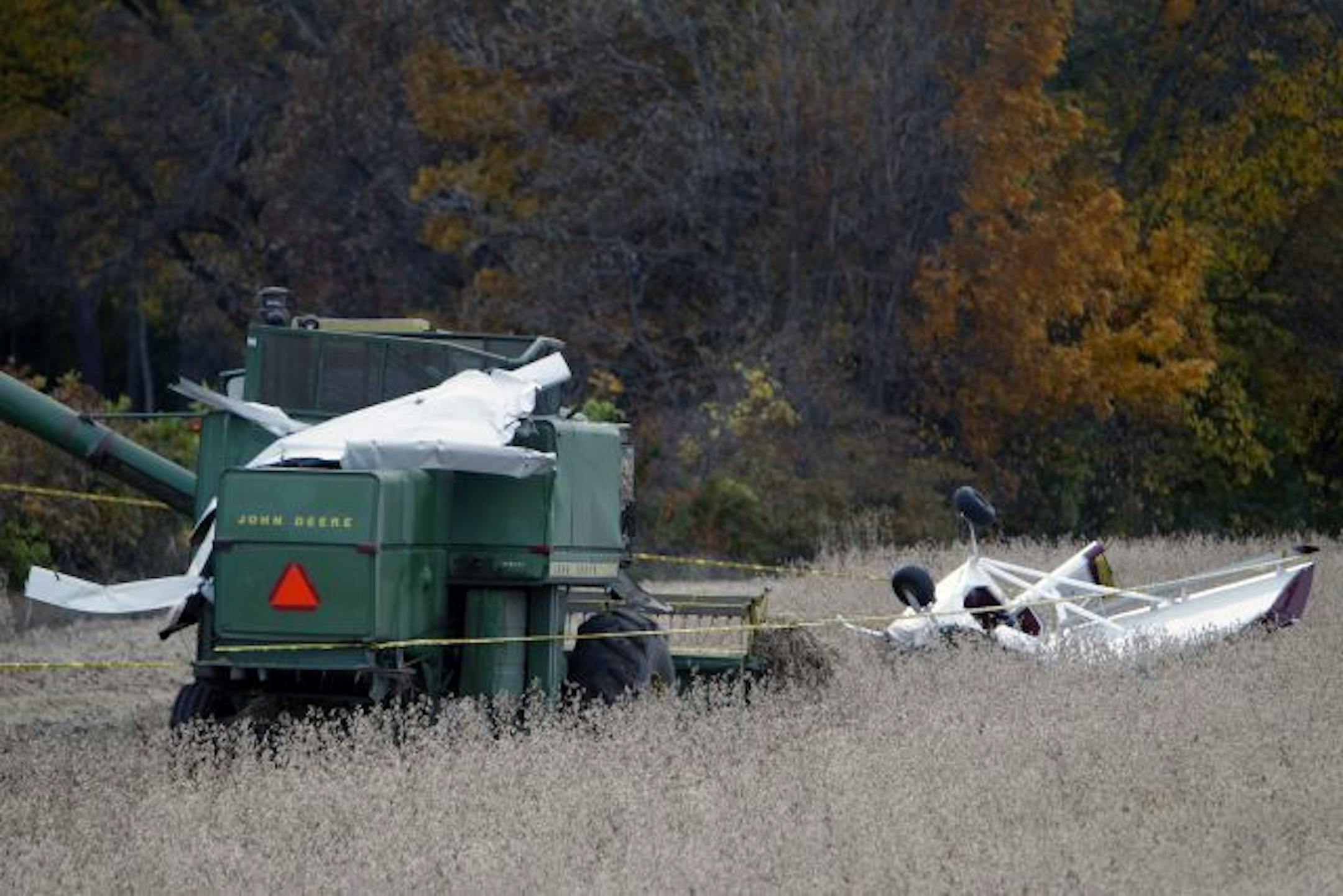 Two people suffered minor injuries when their small plane hit a power line and a combine before crashing in a soybean field Sunday near Lonsdale, Minn.