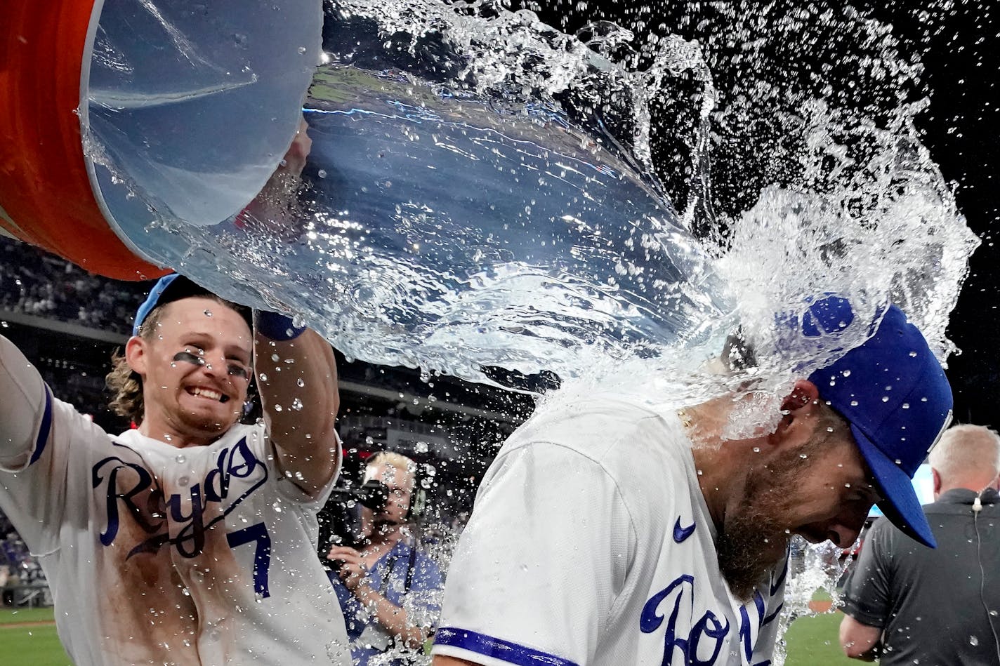 Kansas City Royals' Bobby Witt Jr. (7) douses Kyle Isbel after their baseball game against the Minnesota Twins Saturday, July 29, 2023, in Kansas City, Mo. The Royals won 10-7. (AP Photo/Charlie Riedel)