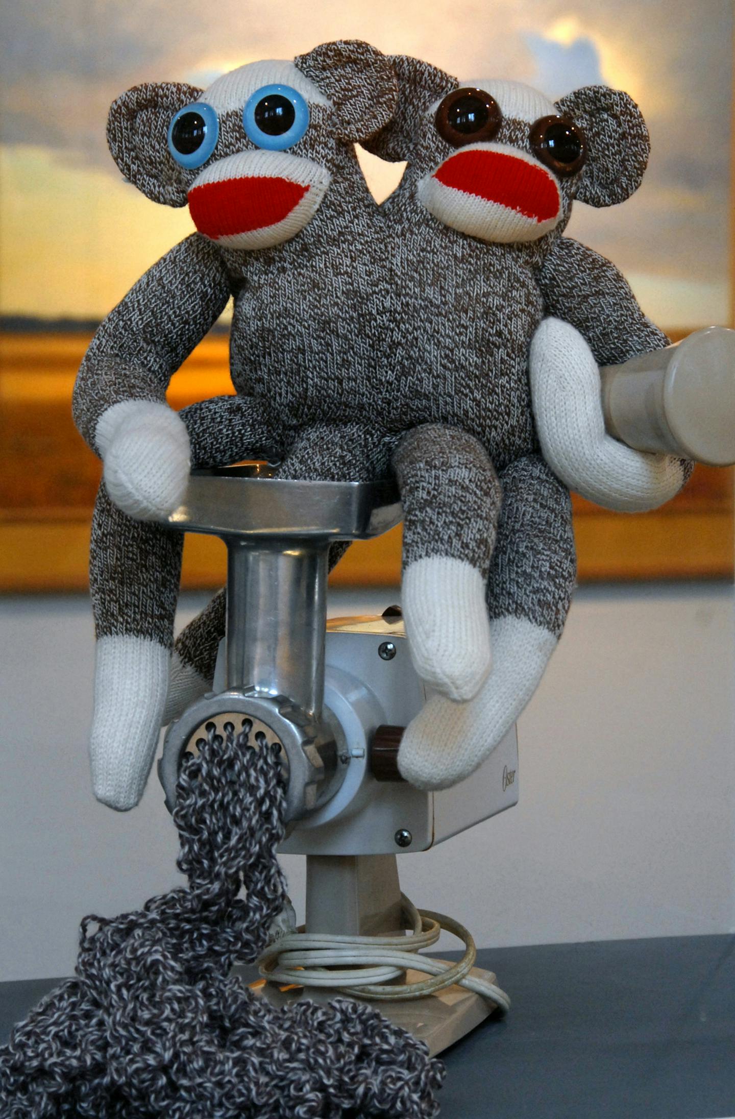 Rebecca Yaker of Minneapolis cleverly straddles the fine line between kitsch and culture with her award-winning "Sock Monkeys in a Meat Grinder."