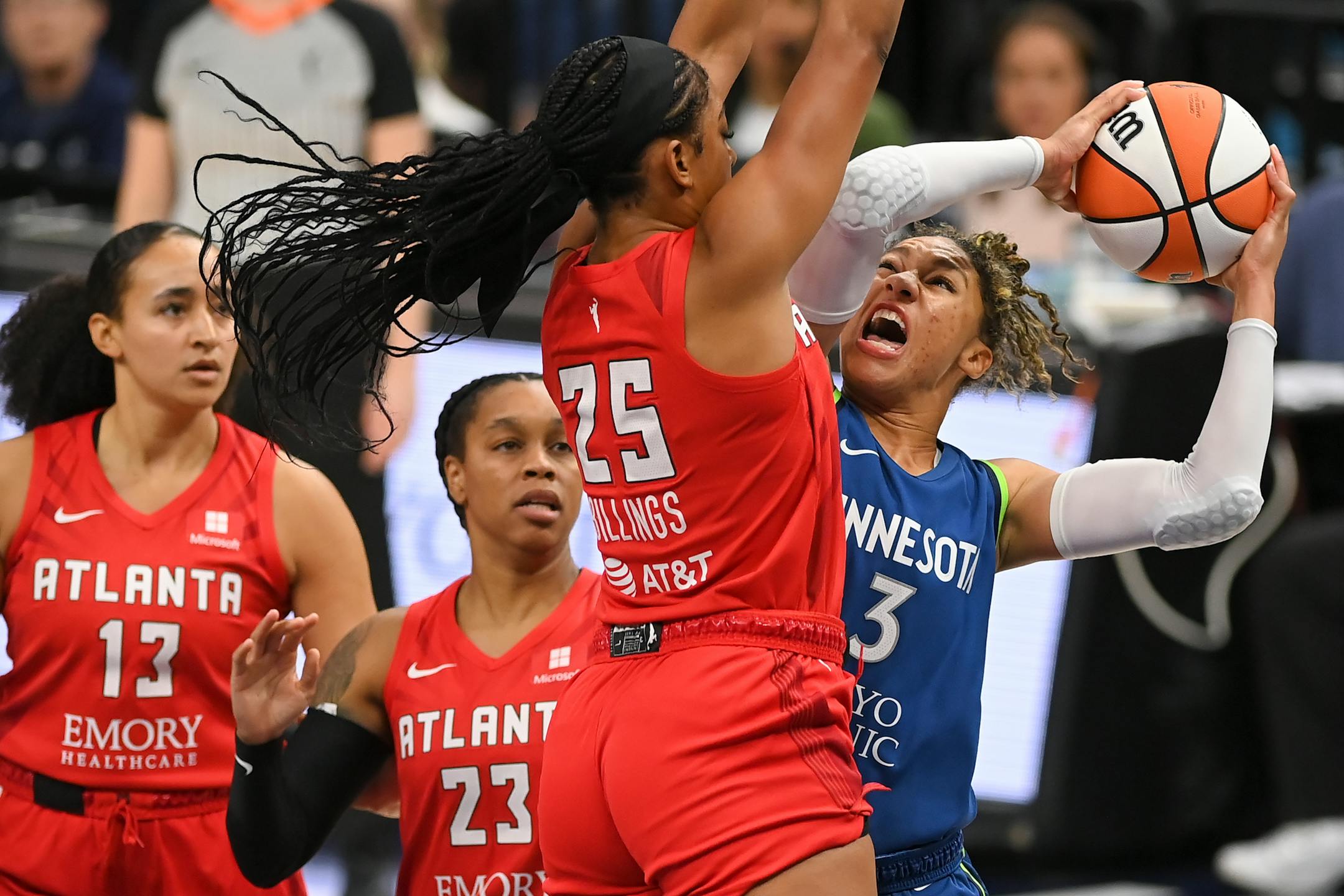 Minnesota Lynx forward Aerial Powers scores a basket under pressure by Atlanta Dream forward Monique Billings in the first quarter.