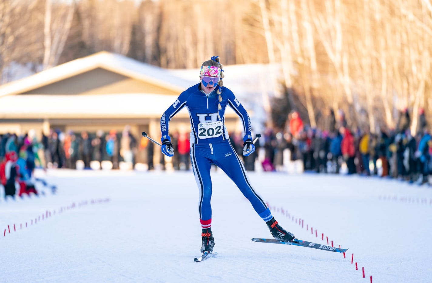 Hopkins skier Sydney Drevlow crosses the finish line of the girls 5k freestyle pursuit race to win the gold medal at the Minnesota State High School League Boys and Girls Nordic Ski Racing State Meet Thursday, Feb. 17, 2022 at Giants Ridge in Biwabik, Minn. ]