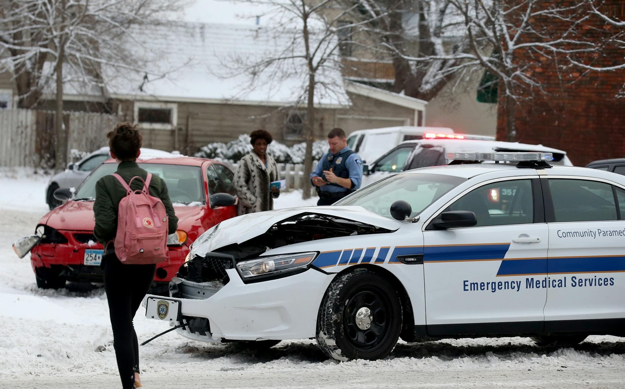 An Emergency Medical Services vehicle was among vehicles involved in crashes, this one at Cedar and 32nd St. South after an overnight snowfall Thursday, Nov. 29, 2018, in Minneapolis, MN.
