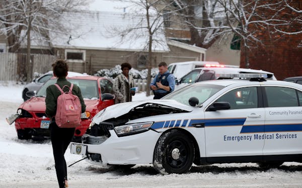 An Emergency Medical Services vehicle was among vehicles involved in crashes, this one at Cedar and 32nd St. South after an overnight snowfall Thursda
