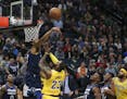 Minnesota Timberwolves center Karl-Anthony Towns (32) swatted away a first half shot by Los Angeles Lakers forward LeBron James (23).